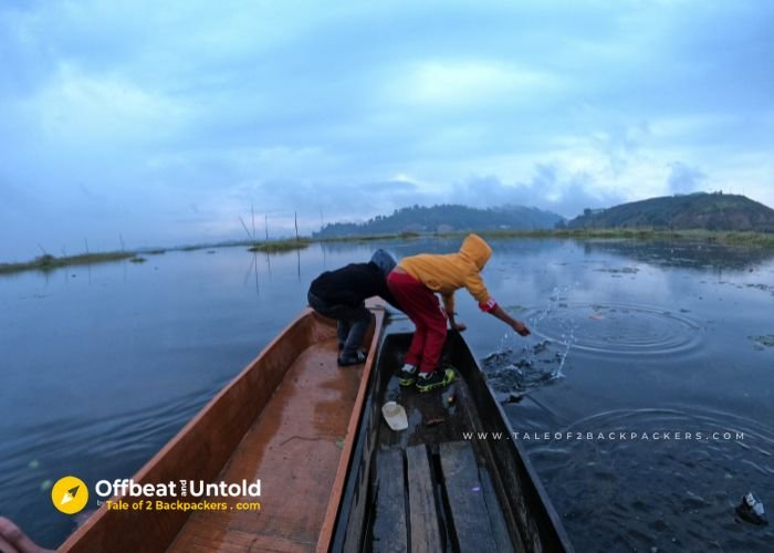 2 kids on a boat at Loktak Lake Manipur